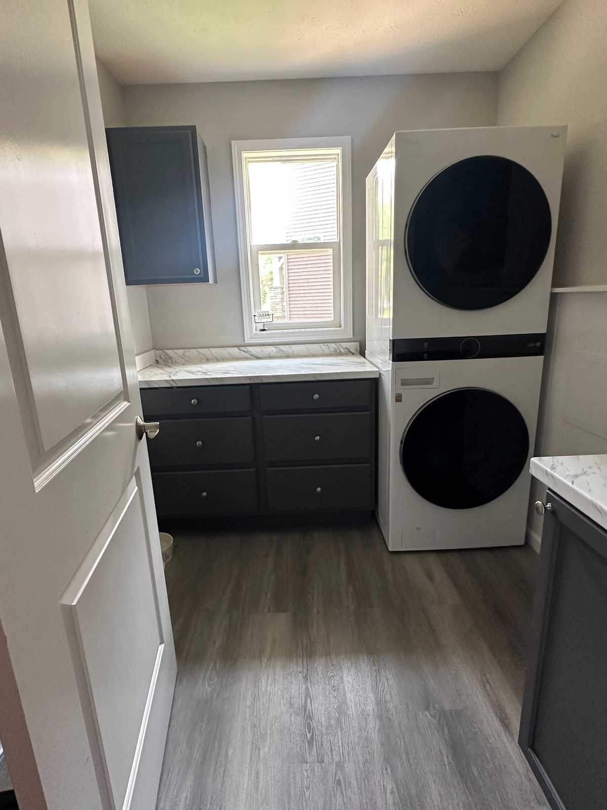 Additional after view of Grand Rapids laundry room remodel with drawers and stacked washer dryer